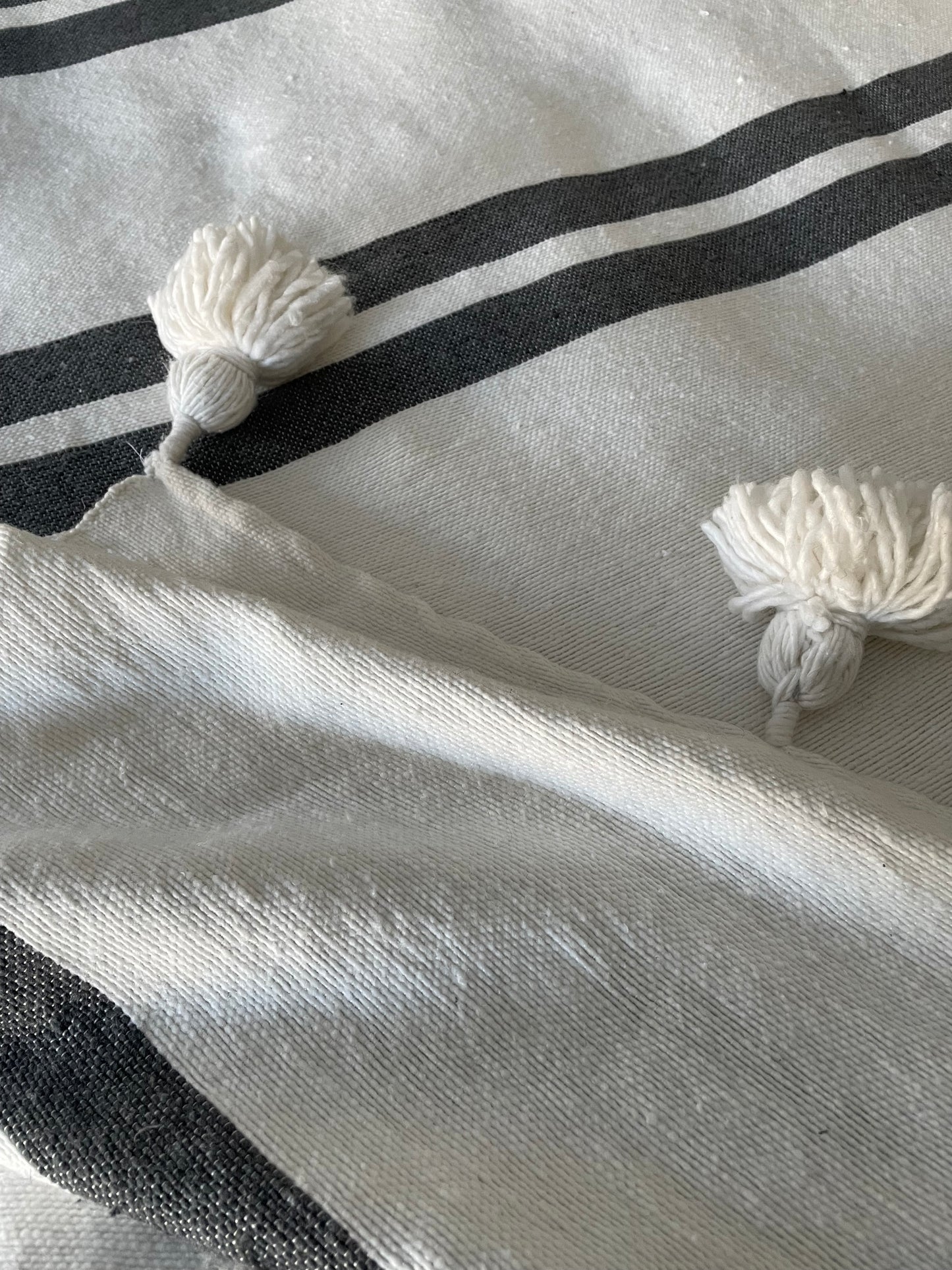 moroccan striped pom pom blanket - grey