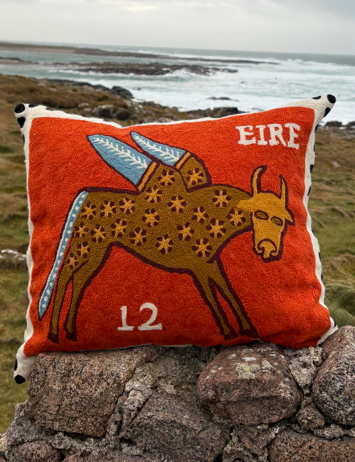 winged ox cushion cover (rust)